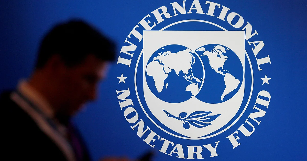Participant stands near a logo of IMF at the International Monetary Fund - World Bank Annual Meeting 2018 in Nusa Dua, Bali, Indonesia, October 12, 2018. Reuters file photo
