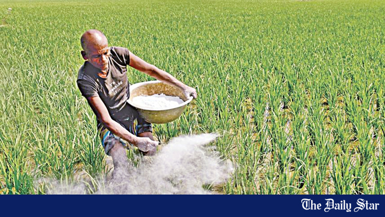 Bangladesh farmer with fertiliser supplies