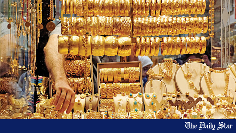 Gold bars and gold price chart showing precious metal trading above 4000 per ounce level with US dollar and Federal Reserve rate outlook